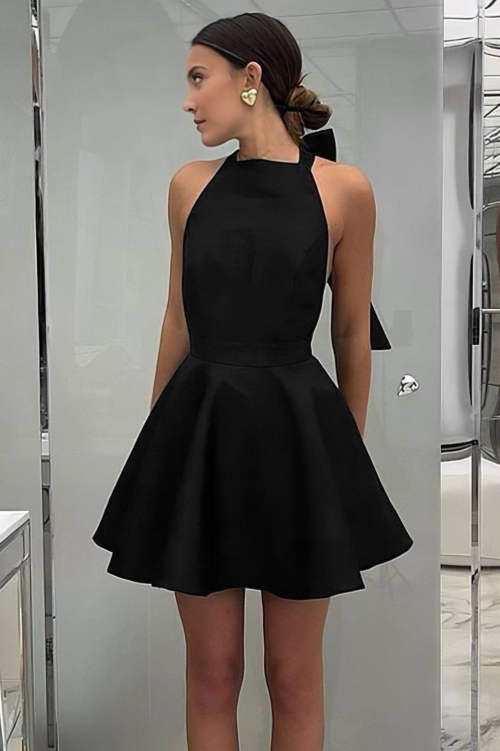 Black high-waisted sleeveless halterneck dress
