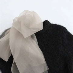 Avant-Garde Knitted Top with Bow Decoration